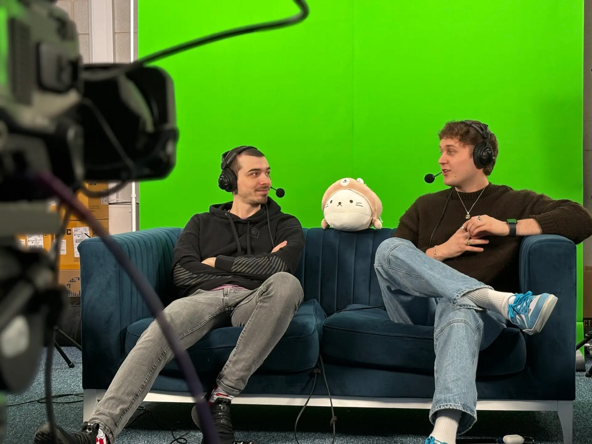 Image depicts League of Legends Caster, Dan 'FoxDrop' Wyatt being interviewed on the podcast by student Louis Skilton in the University Campus of Esports studio.