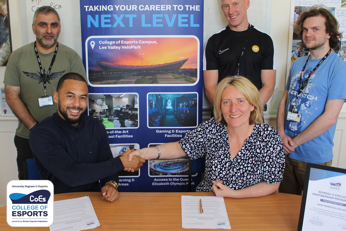 Image depicts Myles Ball (Head of Student Recruitment) shaking hands with the esports lead at East Norfolk College for the School and College Partnership Programme.